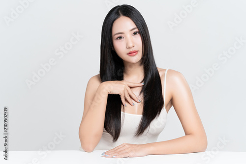 Portrait young Asian woman with beautiful long hair and makeup beauty face on white background.