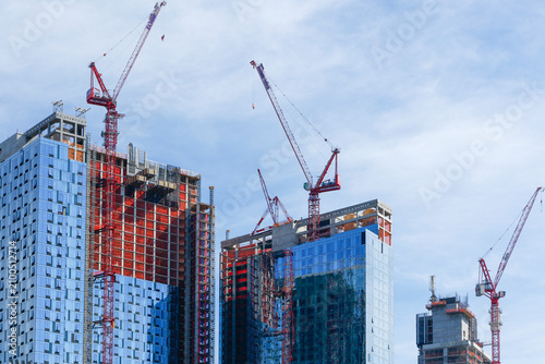Construction Cranes Over High Rise Buildings