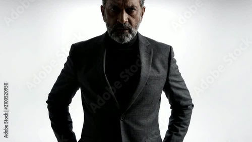 Stylish Mature Man in Elegant Black Suit Portrait.
