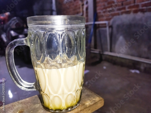 Fotografie It's nothing, just a glass of warm drink that gives you enthusiasm to live life