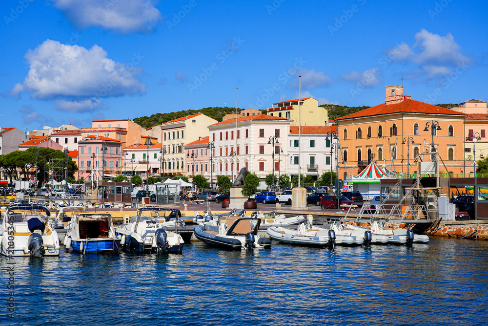 Fototapeta premium Yachts and sailboats moored in Cala Mangiavolpe in La Maddalena, capital city of the eponym archipelago located in the Mediterranean Sea in Sardinia, Italy