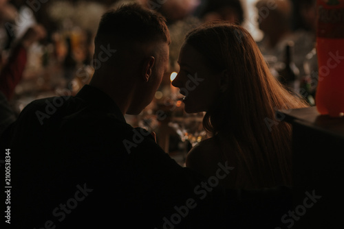 silhouettes of people in the night club