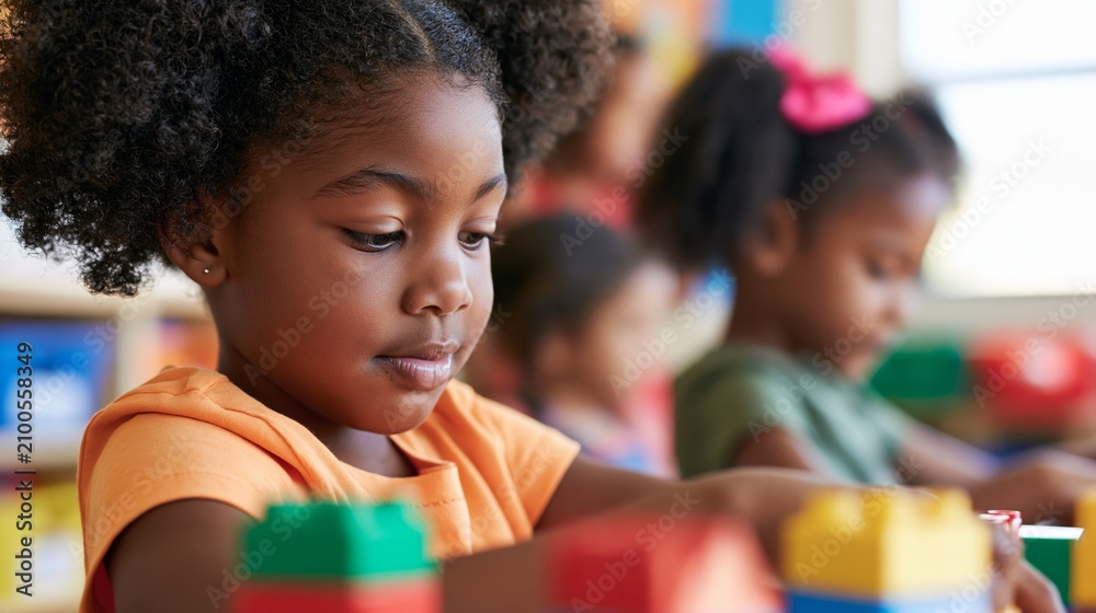 Fototapeta premium Young Girl Building with LEGOs in a Classroom Setting, Surrounded by Her Peers and Instructors' Presence