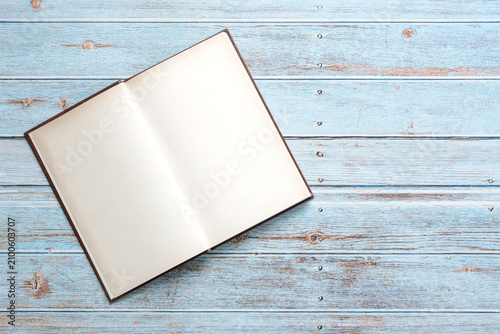 Top view of open book with space for text