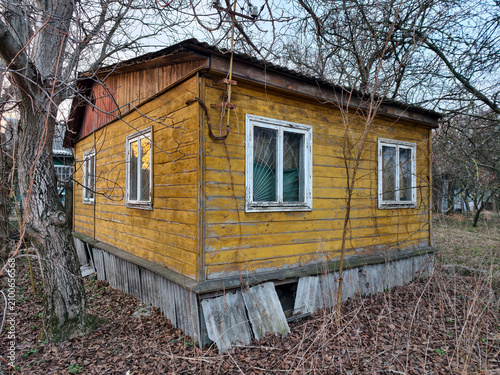 Dilapidated house in countryside. Old abandoned wooden house