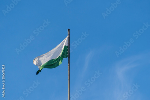 Canvastavla Flag of Antioquia waving in a blue cloudy