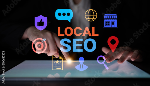 Konstfotografi A business professional utilizes modern technology to enhance local SEO, showcasing various digital marketing elements for improved online visibility and engagement