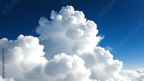 Epic Cumulus Clouds Rising High Above a Bright Blue Sky on a Sunny Day