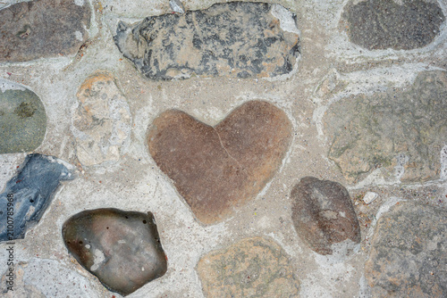 Bild auf Leinwand Heart-Shaped Stone in the Wall.