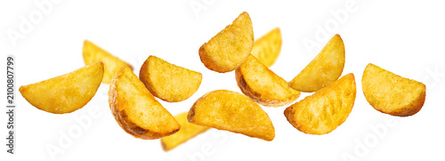 Картината върху платно Crispy baked potato wedges scattered in weightless motion, isolated on transpare
