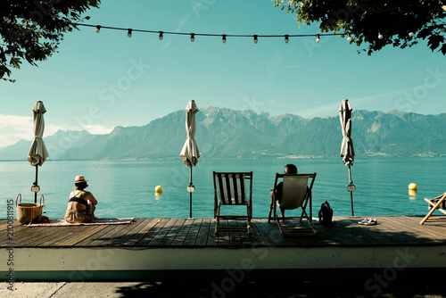 Peaceful morning on Lake Geneva in Vevey, Switzerland, with Alpine mountain panorama