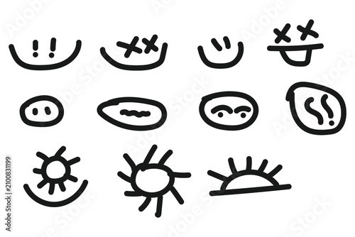 Set of hand drawn doodle faces and sun symbols in black ink sketch style for creative design