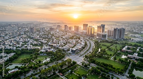 Aerial view of modern cityscape at sunrise with urban skyline