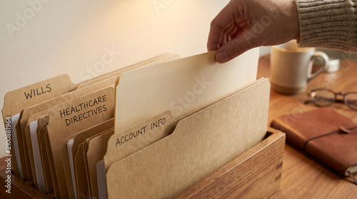 Hand organizing wills and healthcare directive file folders