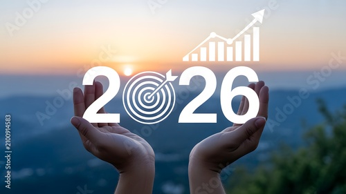 Human hands present the year 2026 with a goal and upward trend against mountain sunset