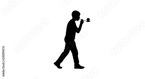 Silhouette of a person playing egg and spoon race