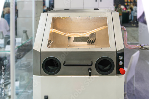 Fotografie Industrial sandblasting or bead blasting cabinet with glove ports