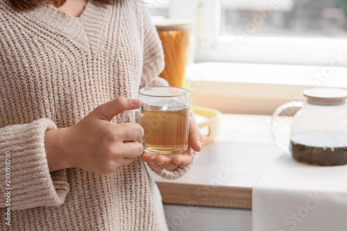 Woman in a cozy knitted swe...