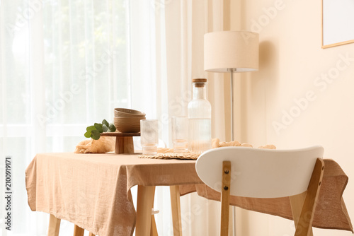 Dining table with a beige t...