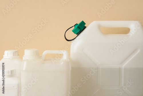 White plastic jerry cans an...