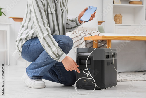 Person charging a smartphon...