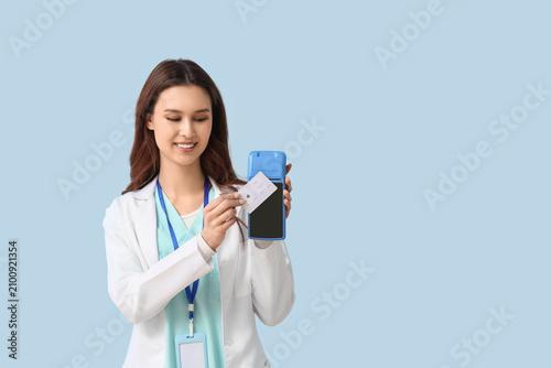 Female doctor with payment ...