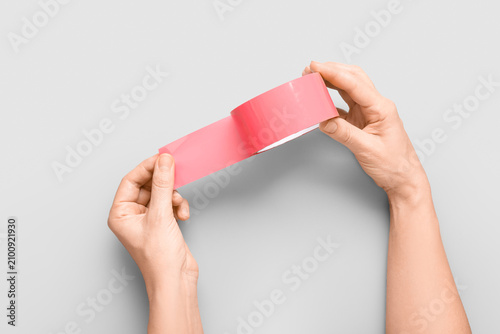 Hands holding and unrolling...