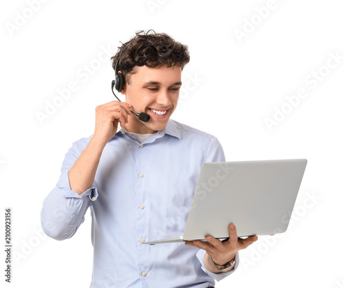 Young male online business consultant with headset and laptop video chatting ...