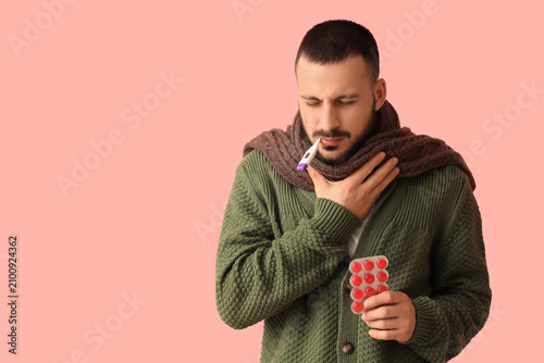 Ill young man with throat l...