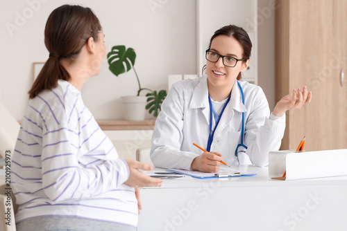 Female doctor working with ...