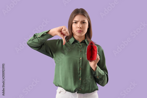 Young woman with empty purs...