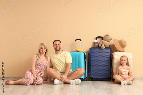Happy family sitting with s...