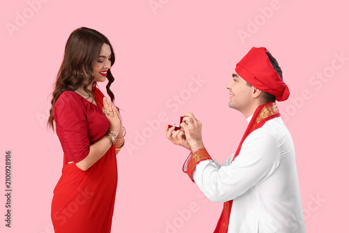 Young Indian man with engag...