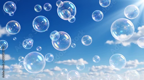 A beautiful clear blue sky filled with hundreds of crystal-clear transparent soap bubbles drifting gracefully in the air