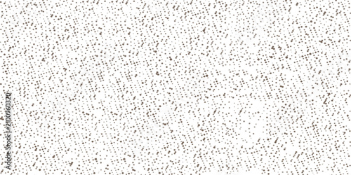Photos A highly detailed macro shot captures the intricate texture of a speckled white surface, revealing a mosaic of subtle grey and black speckles against a bright background