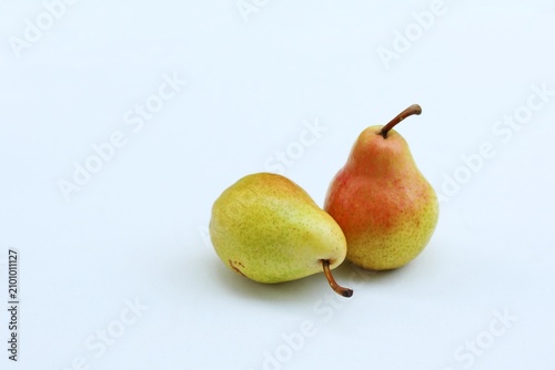 Quadro su tela Two Ripe Yellow Pears with Red Blush Isolated on White Background