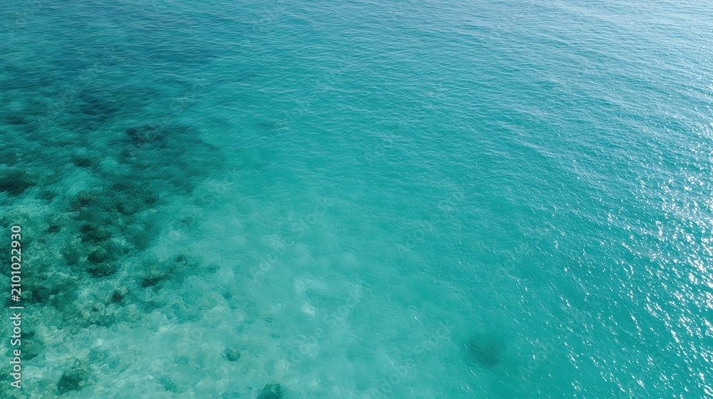 Obraz premium Crystal Clear Turquoise Ocean Water Surface with Underwater Reef Texture