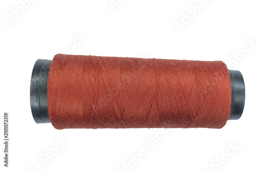 Cuadro en lienzo Professional orange sewing thread spool presented isolated on a transparent background