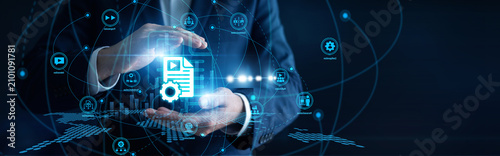 Obraz na plátně Digital marketer hands hold a tablet updating the enterprise Content Management platform
