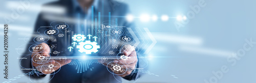 Photography Robotics engineer hold tablet and monitors factory assembly lines powered by smart Automation, optimizing conveyor belt speeds and machine precision