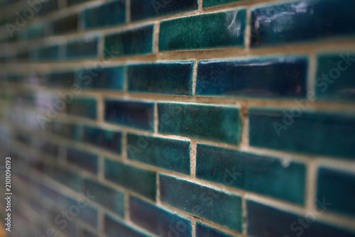 Obraz na plátne Close-up view of teal glossy brick wall tiles with beige grout
