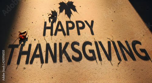 Happy thanksgiving shadow lettering with autumn leaf decoration