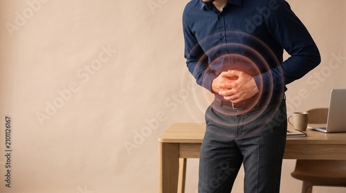 Business Person Experiencing Severe Stomach Pain