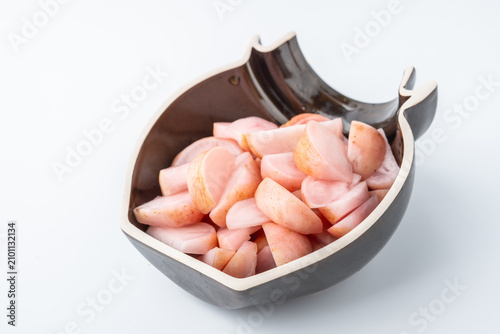 A jar of pickled radish cut into chunks