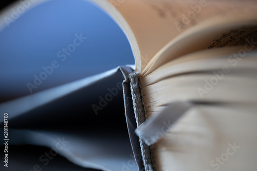 Konstfotografi Open book pages showing a bookmark for reading