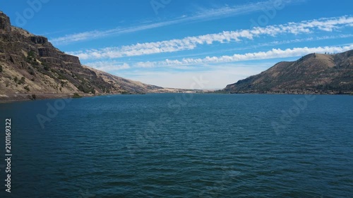 Stationary flight over green water of the Columbia River looking east.