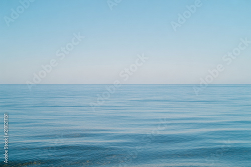 Calm ocean waves, serene sea landscape, blue water, peaceful scenery
