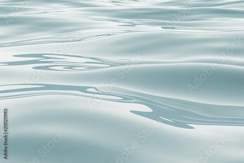 Calming water surface, gentle waves, serene ocean texture, blue background