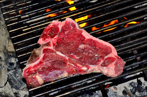 T-Bone steak on campfire