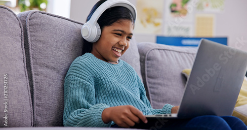 Canvastavla Streaming, headphones or child in home with laptop, cartoon series or online game on weekend break